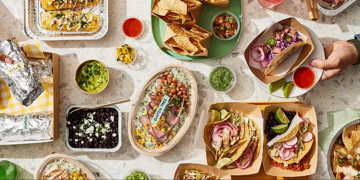 A wide spread of tacos, burritos and sides at a team lunch